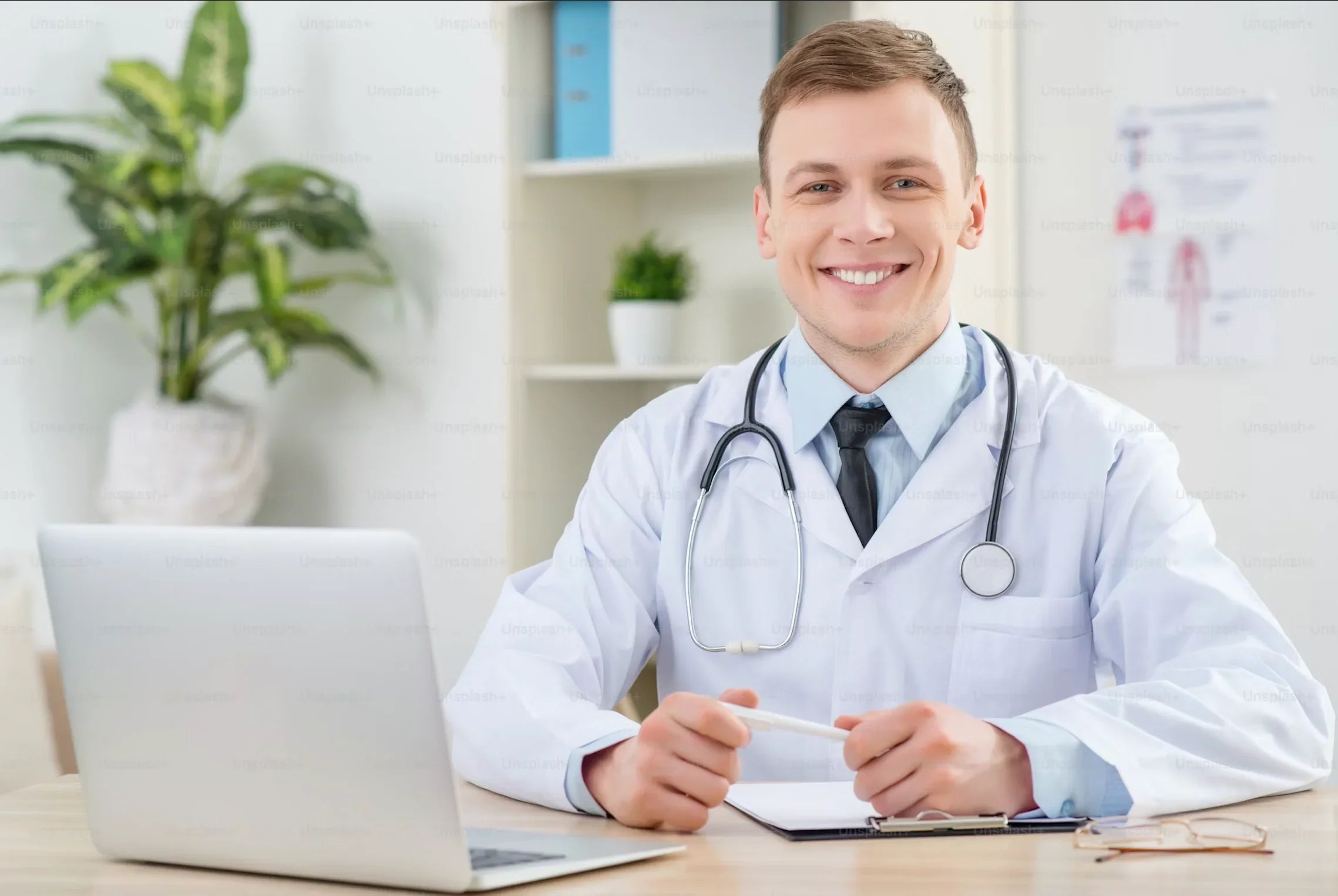 Smiling doctor with stethoscope at desk, promoting Magnascent Iodine health benefits