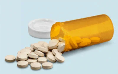 Prescription pill bottle with tablets spilled, suggesting thyroid medication alternatives