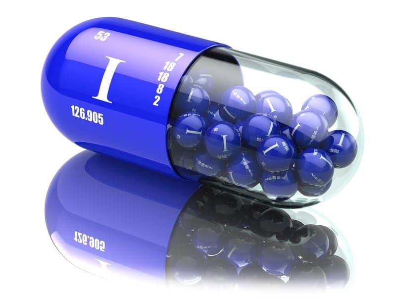 Blue iodine supplement capsule with element symbols, promoting Magnascent Nascent Iodine benefits