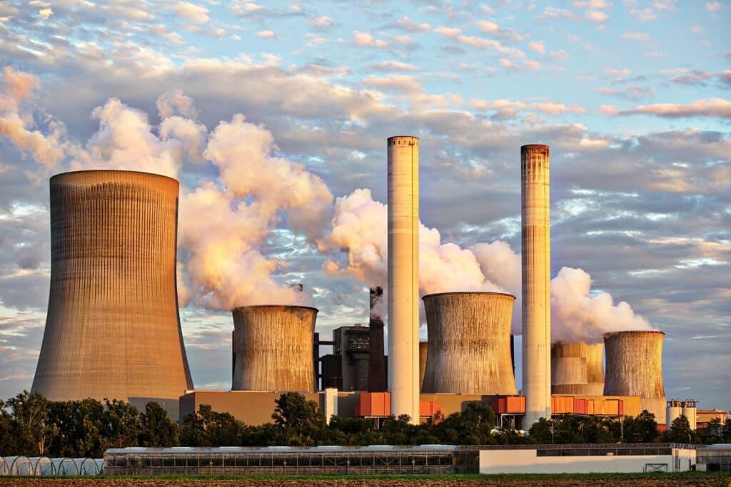 Industrial power plant with cooling towers emitting steam, related to iodine health benefits
